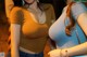 Two women standing next to each other in a room.